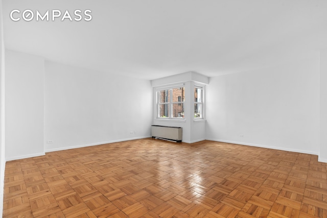 101 W 12th St Unit 3Z, New York City, NY 10011 - unfurnished room featuring baseboards and radiator heating unit