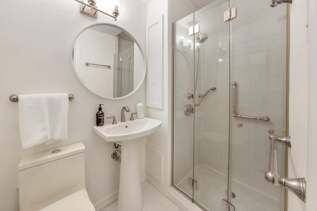 25 W 54th St Unit 8H, New York City, NY 10019 - full bath with toilet, a stall shower, and tile patterned flooring