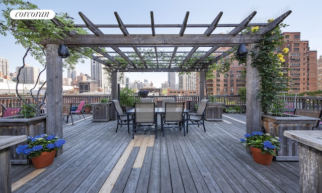 325 E 80th St Unit 1F, New York City, NY 10075 - deck featuring a pergola, a view of city, and outdoor dining space