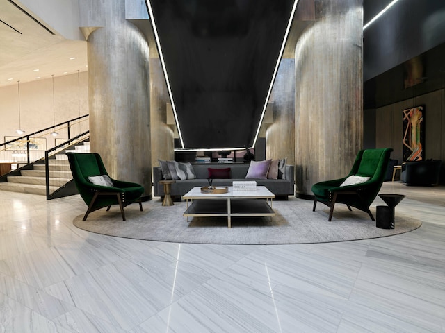 252 S St Unit 27L, New York City, NY 10002 - building lobby featuring a high ceiling and stairway