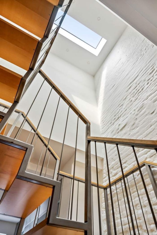 204 W Houston St Unit 4A/5A, New York City, NY 10014 - staircase featuring a skylight and a towering ceiling