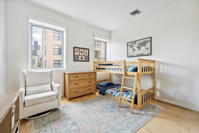 204 W Houston St Unit 4A/5A, New York City, NY 10014 - bedroom featuring light wood-style floors and baseboards