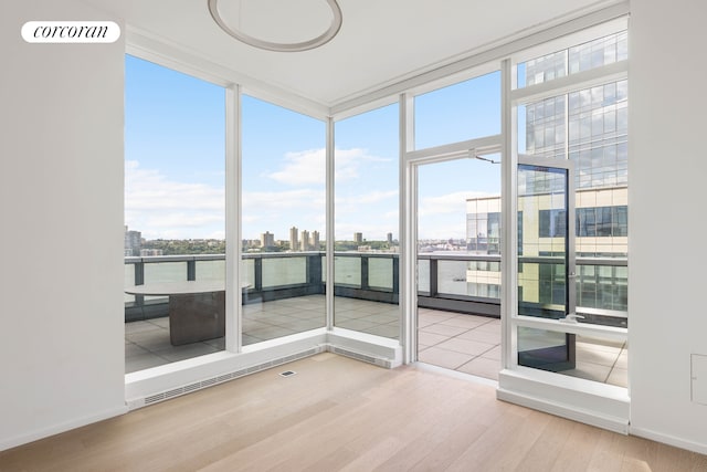 30 Riverside Blvd Unit 20C, New York City, NY 10069 - unfurnished sunroom with plenty of natural light, a view of city, and a water view