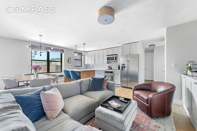 185 Prospect Park SW Unit 609, New York City, NY 11218 - living area with light wood-style flooring