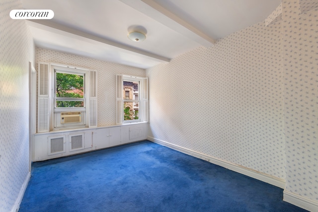 114 E 90th St Unit 5B, New York City, NY 10128 - spare room featuring wallpapered walls, beamed ceiling, carpet flooring, and cooling unit