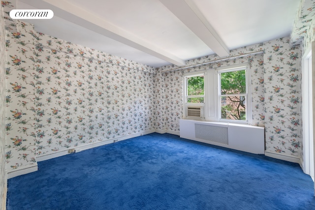 114 E 90th St Unit 5B, New York City, NY 10128 - carpeted spare room featuring radiator, beam ceiling, and wallpapered walls