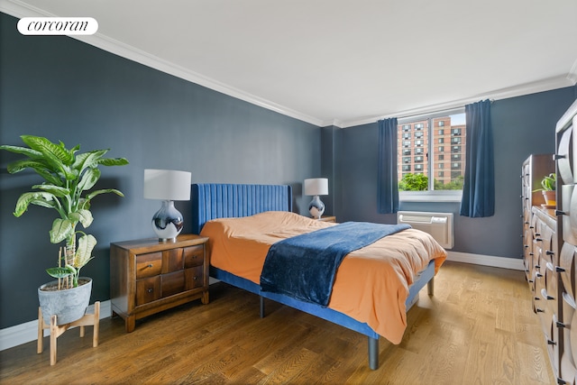 625 Main St Unit 643, New York City, NY 10044 - bedroom featuring crown molding, wood finished floors, and a wall mounted AC