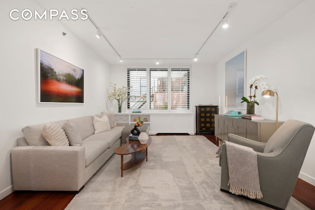 50 W 15th St Unit 2D, New York City, NY 10011 - living area featuring rail lighting, wood finished floors, and baseboards