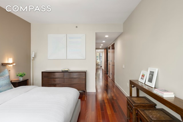 50 W 15th St Unit 2D, New York City, NY 10011 - bedroom with wood finished floors, baseboards, and recessed lighting