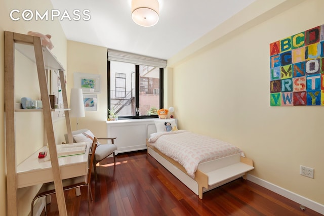 50 W 15th St Unit 2D, New York City, NY 10011 - bedroom featuring dark wood finished floors and baseboards