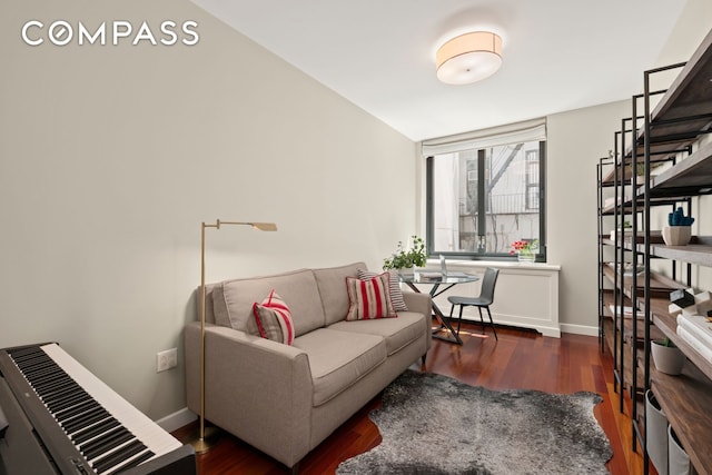50 W 15th St Unit 2D, New York City, NY 10011 - living area with dark wood-style floors and baseboards