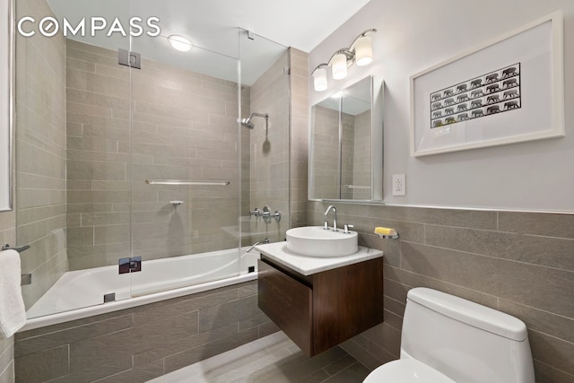 50 W 15th St Unit 2D, New York City, NY 10011 - full bath featuring tiled shower / bath combo, toilet, vanity, and tile walls