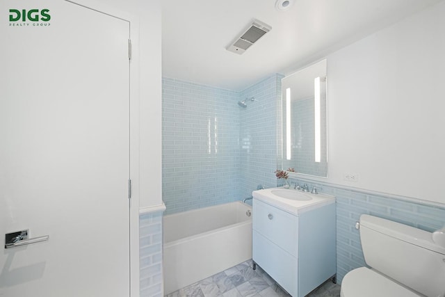389 E 89th St Unit 27A, New York City, NY 10128 - bathroom with vanity, shower / bathtub combination, and tile walls