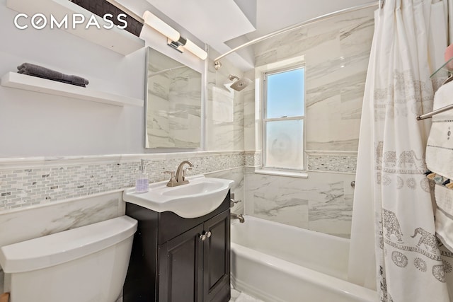 5730 Mosholu Ave Unit 4Ff, New York City, NY 10471 - bathroom featuring tile walls, shower / tub combo with curtain, toilet, vanity, and wainscoting