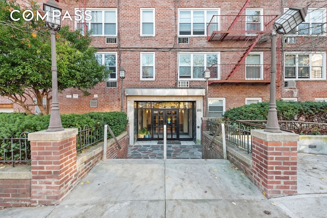 5730 Mosholu Ave Unit 4Ff, New York City, NY 10471 - doorway to property featuring french doors, brick siding, and concrete driveway