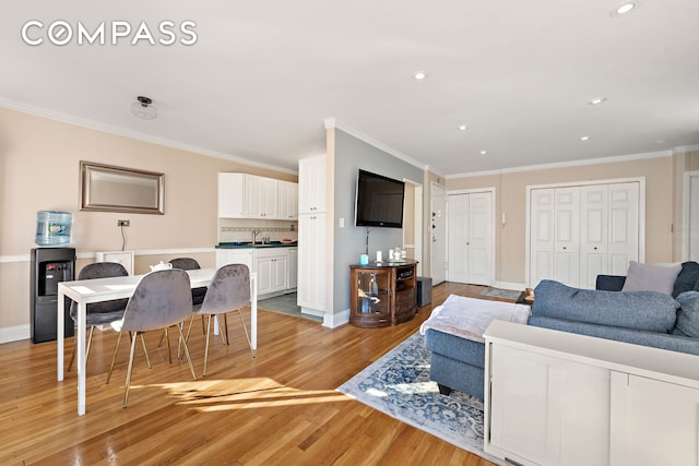 5730 Mosholu Ave Unit 4Ff, New York City, NY 10471 - living room with light wood finished floors, crown molding, recessed lighting, and baseboards