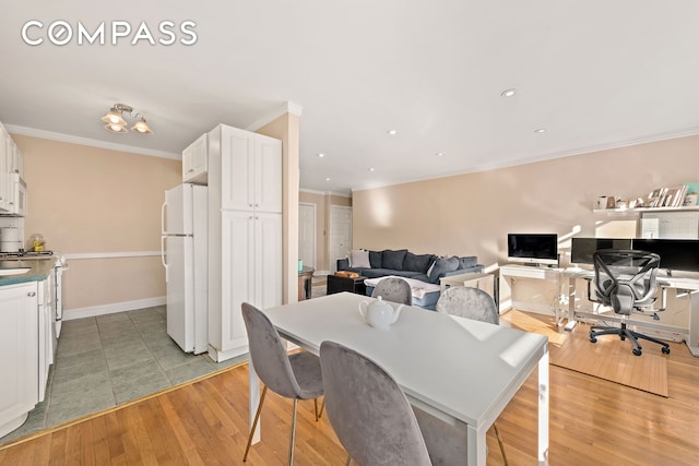 5730 Mosholu Ave Unit 4Ff, New York City, NY 10471 - dining space featuring ornamental molding, a desk, light wood-style floors, baseboards, and recessed lighting