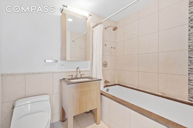 350 W 42nd St Unit 48E, New York City, NY 10036 - bathroom with tile walls, tiled shower / bath, and vanity