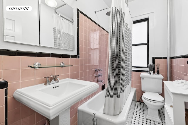 875 W 181st St Unit 6B, New York City, NY 10033 - bathroom with tile walls, toilet, shower / bath combination with curtain, tile patterned flooring, and a sink