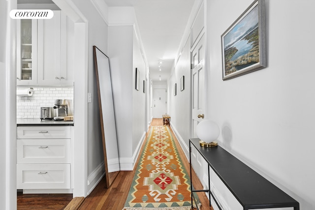 875 W 181st St Unit 6B, New York City, NY 10033 - hallway featuring wood finished floors and baseboards