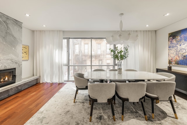 9 Minetta St, New York City, NY 10012 - dining room with wood finished floors, a premium fireplace, and recessed lighting