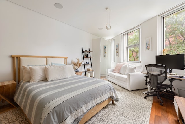 9 Minetta St, New York City, NY 10012 - bedroom featuring wood finished floors, a desk, and vaulted ceiling