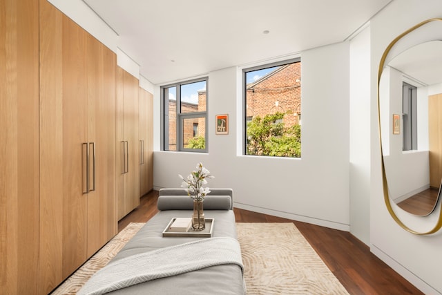 9 Minetta St, New York City, NY 10012 - bedroom with wood finished floors, baseboards, and arched walkways