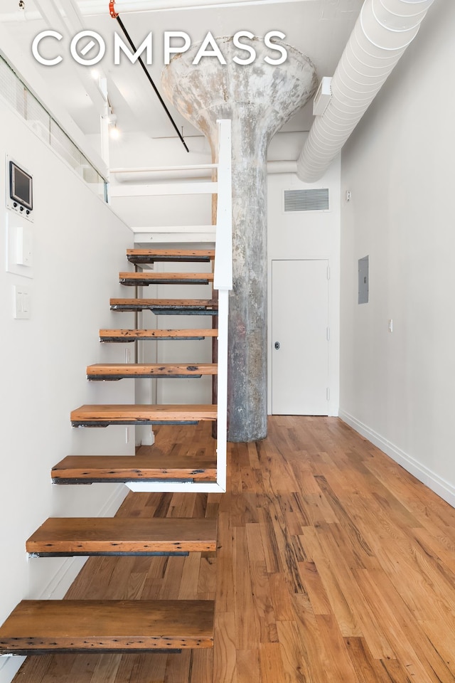689 Myrtle Ave Unit 4E, New York City, NY 11205 - staircase featuring wood finished floors and electric panel