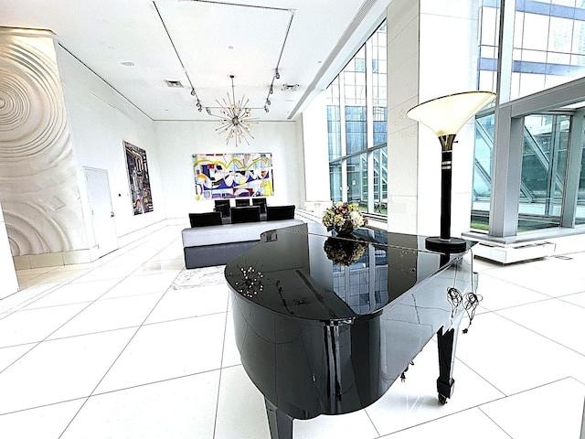 635 W 42nd St Unit 4K, New York City, NY 10036 - dining space featuring track lighting, a chandelier, and tile patterned flooring