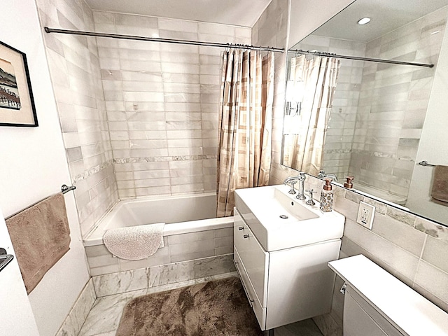 635 W 42nd St Unit 4K, New York City, NY 10036 - full bathroom featuring vanity, tiled shower / bath combo, and recessed lighting