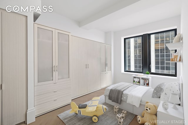 101 Wall St Unit 17A, New York City, NY 10005 - bedroom featuring a closet and wood finished floors