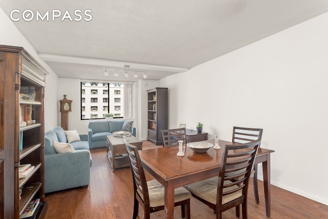 275 W 96th St Unit 12B, New York City, NY 10025 - dining area with dark wood finished floors, baseboards, and track lighting
