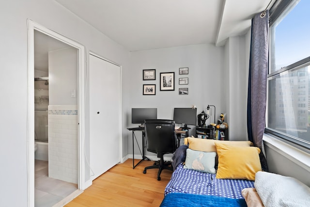 225 E 36th St Unit 15-A, New York City, NY 10016 - office area with light wood-type flooring