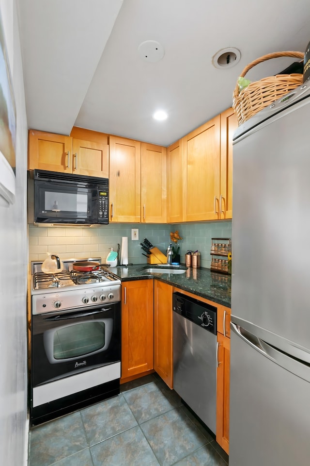 225 E 36th St Unit 15-A, New York City, NY 10016 - kitchen with appliances with stainless steel finishes, backsplash, a sink, and tile patterned floors