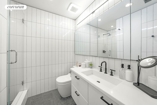176 Johnson St Unit 2E, New York City, NY 11201 - full bathroom with tile walls, vanity, a shower stall, and decorative backsplash