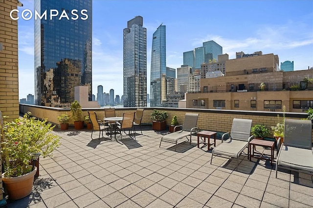 301 E 48th St Unit 5D, New York City, NY 10017 - view of patio / terrace with a view of skyline