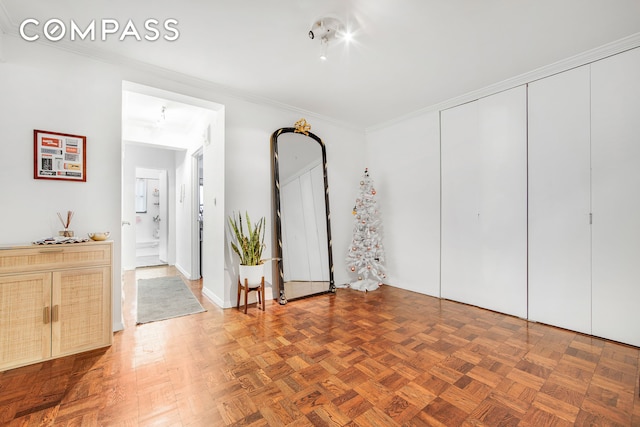 301 E 48th St Unit 5D, New York City, NY 10017 - unfurnished bedroom with ornamental molding, a closet, and connected bathroom