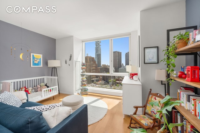 200 Chambers St Unit 25F, New York City, NY 10007 - living area featuring wood finished floors and a skyline view