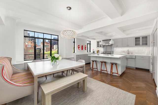 130 W 12th St Unit 9A, New York City, NY 10011 - dining room featuring a chandelier, beam ceiling, and recessed lighting