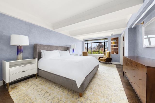 130 W 12th St Unit 9A, New York City, NY 10011 - bedroom featuring baseboards, wood finished floors, and beamed ceiling