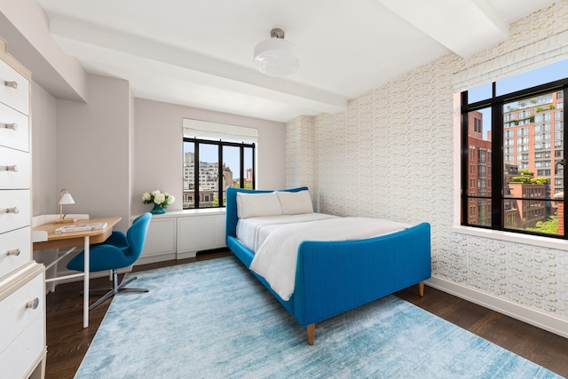 130 W 12th St Unit 9A, New York City, NY 10011 - bedroom with wallpapered walls, baseboards, wood finished floors, an office area, and beam ceiling
