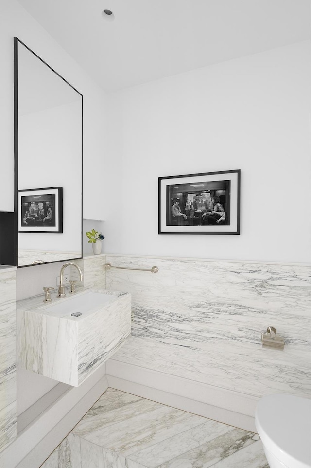 500 W 18th St Unit East15E, New York City, NY 10011 - half bathroom featuring marble finish flooring and toilet