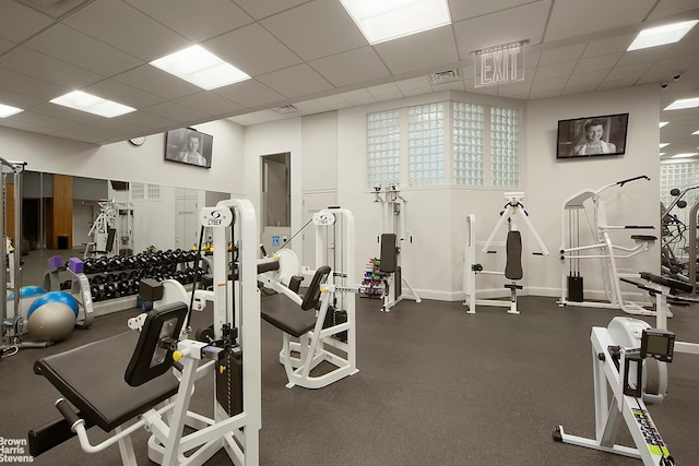 120 E 87th St Unit R14F, New York City, NY 10128 - exercise room with a drop ceiling and baseboards