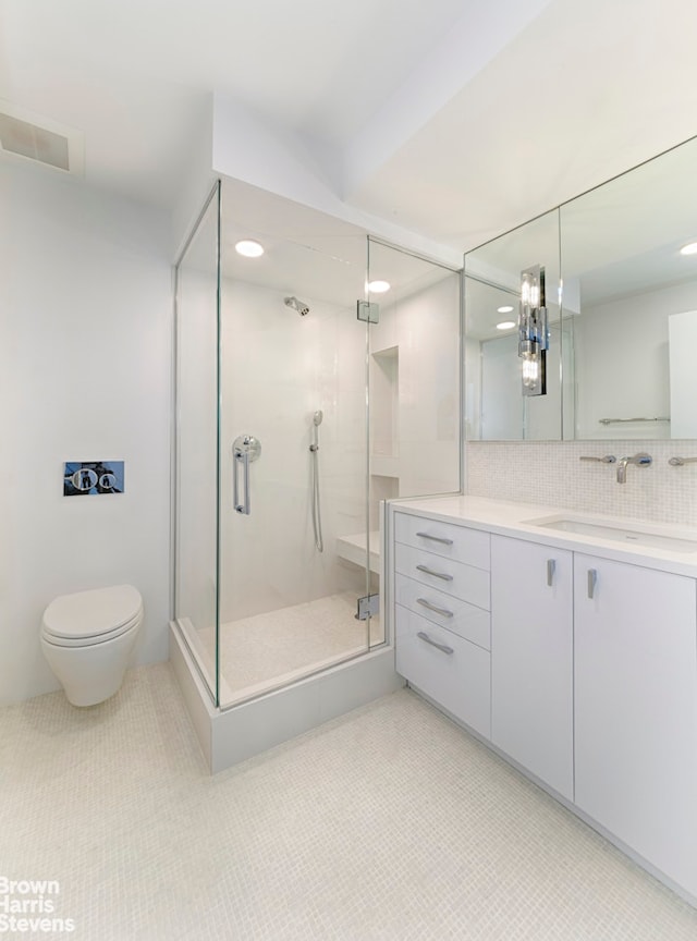 120 E 87th St Unit R14F, New York City, NY 10128 - full bath featuring a shower stall, vanity, backsplash, tile patterned floors, and recessed lighting