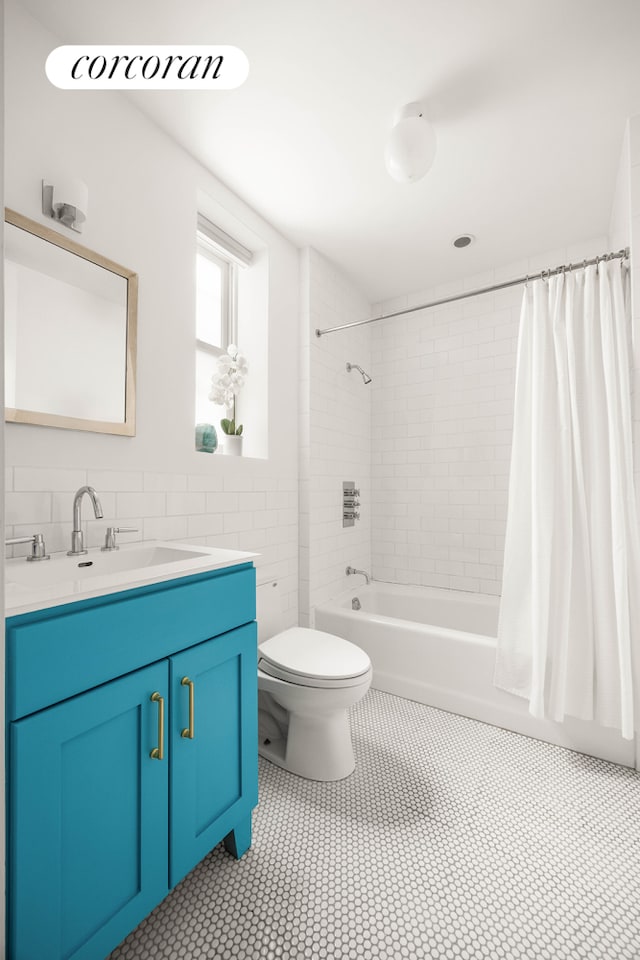 4015 7th Ave Unit 1, New York City, NY 11232 - bathroom featuring vanity, shower / tub combo, tile walls, and tile patterned floors