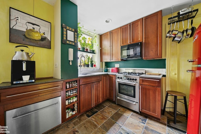 155 E 91st St Unit 5C, New York City, NY 10128 - kitchen featuring black microwave, stainless steel stove, stone tile flooring, recessed lighting, and a warming drawer