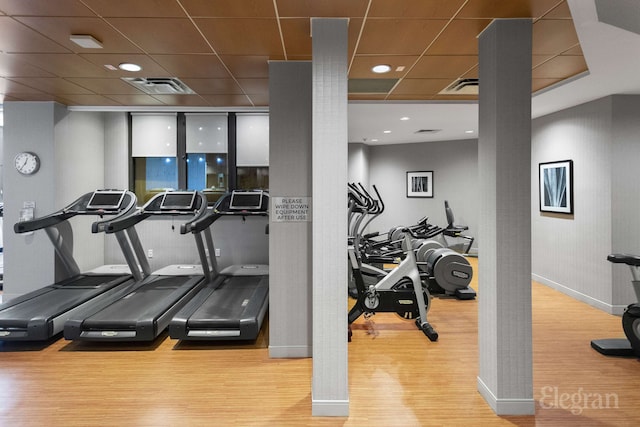 330 E 38th St Unit 8Ij, New York City, NY 10016 - gym featuring wood finished floors, a paneled ceiling, and baseboards