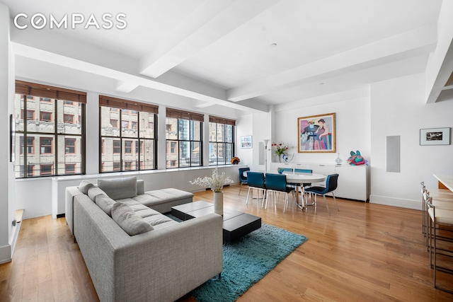 130 W 30th St Unit 16A, New York City, NY 10001 - living area with beam ceiling and wood finished floors
