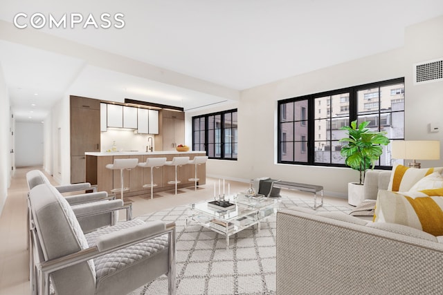 959 1st Ave Unit 6P, New York City, NY 10022 - living area featuring baseboards and wet bar