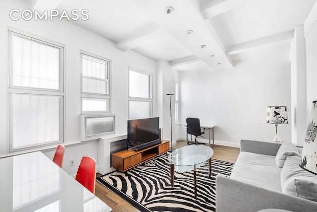 66 Madison Ave Unit 1D, New York City, NY 10016 - living area featuring wood finished floors, beam ceiling, and a desk